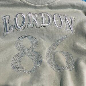 New with TAGS Planet Heart Juniors' Bubble Hem Varsity Crewneck Sweatshirt